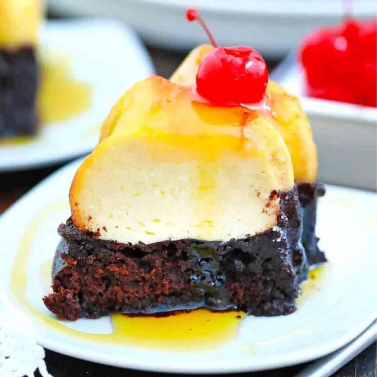 A slice of chocolate flan with a red cherry on top