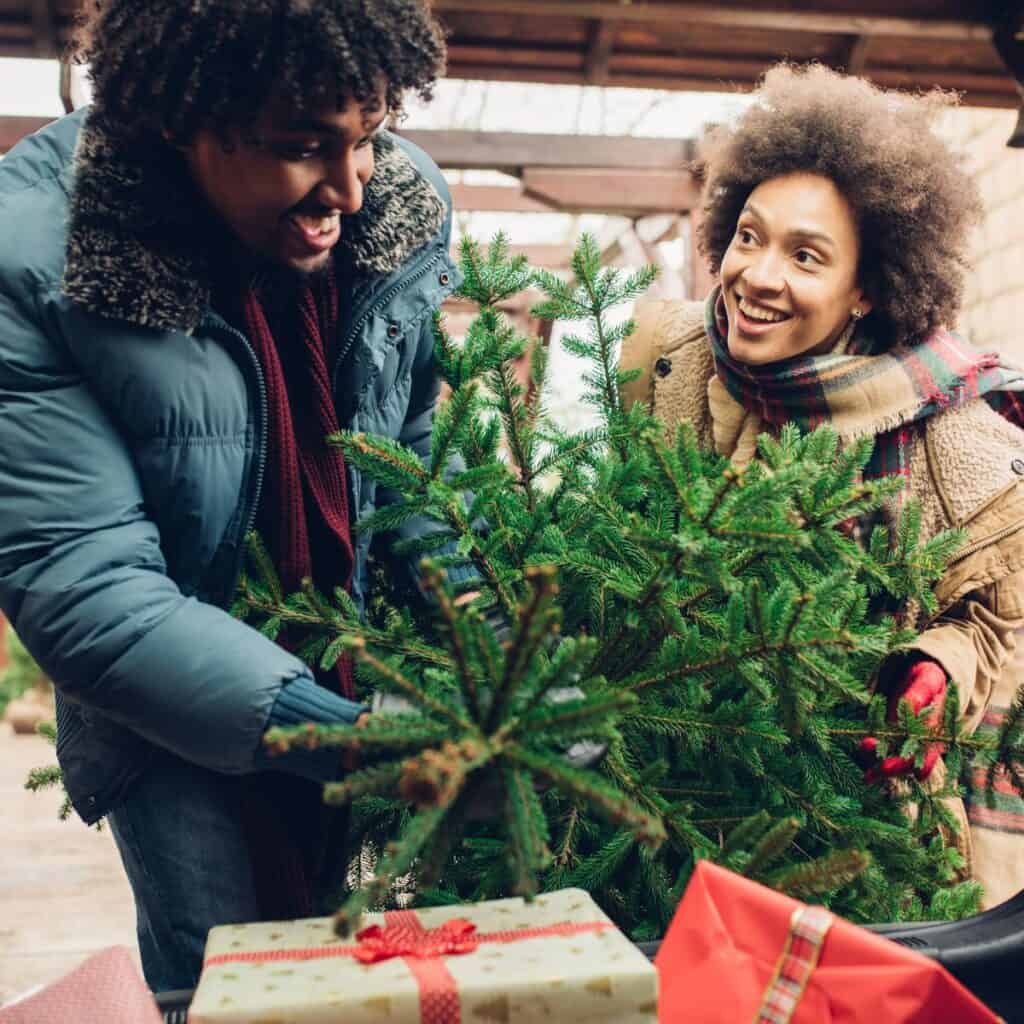 A couple doing a scavenger hunt after reading these Christmas date ideas