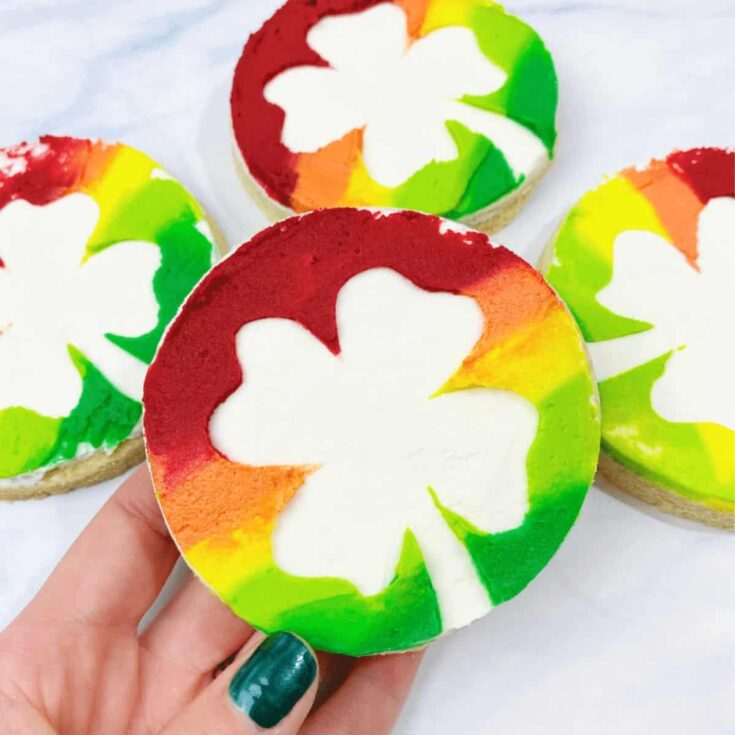Decorated rainbow buttercream frosting cookies made after reading these St Patricks Day cookies