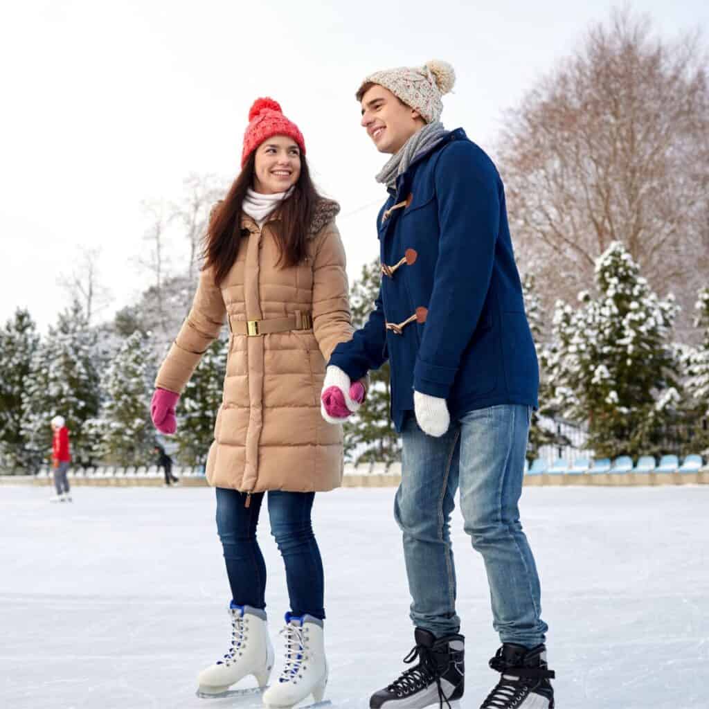 A couple skating together after reading these Christmas date ideas