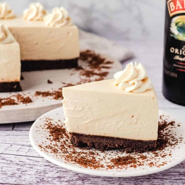 A slice of a no bake Baileys cheesecake made after reading these St. Patricks Day desserts