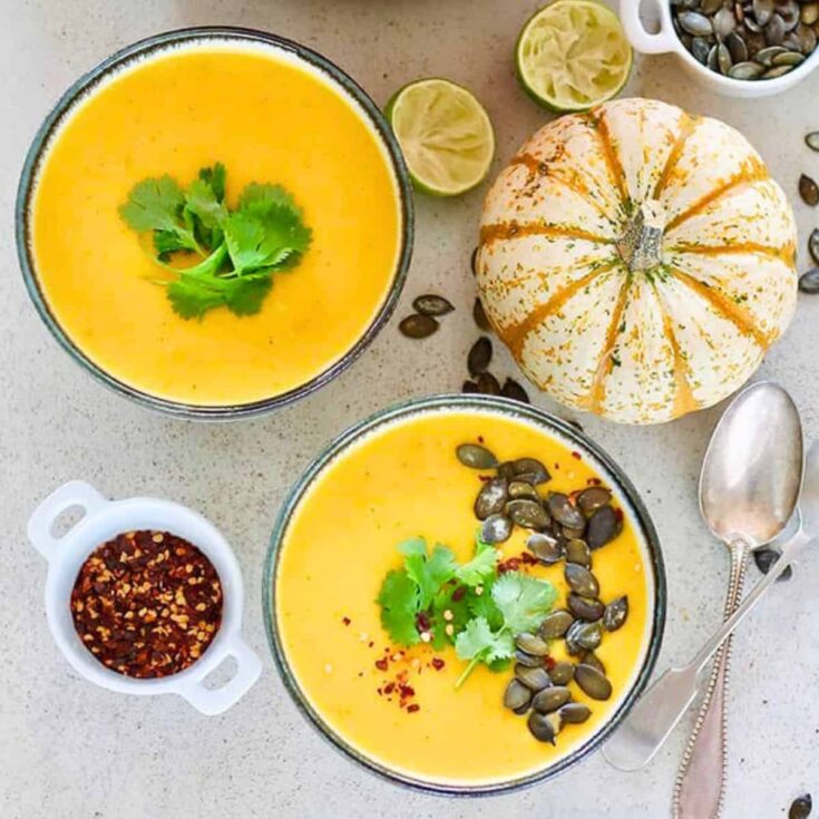 Two bowls of pumpkin curry soup made after reading these Fresh pumpkin recipes