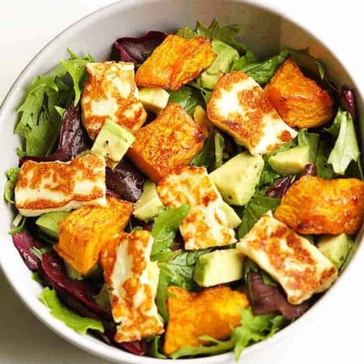 A bowl of pumpkin halloumi and avocado salad made after reading these Fresh pumpkin recipes