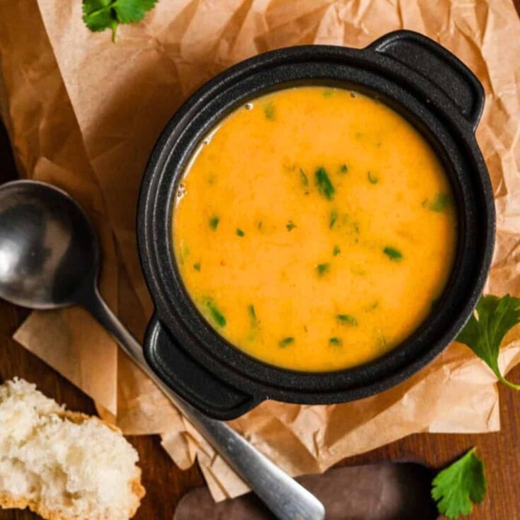 A bowl of pumpkin sweet potato leek and coconut milk soup made after reading these Fresh pumpkin recipes