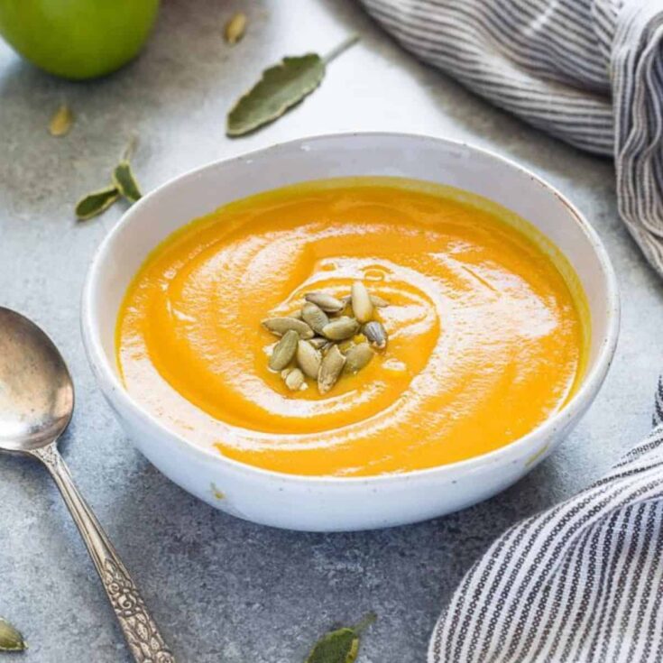 A bowl of roasted pumpkin apple soup made after reading these Fresh pumpkin recipes