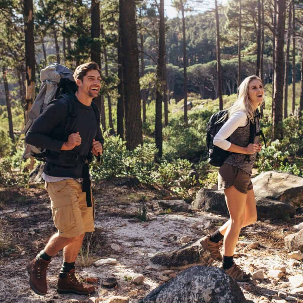 A couple hiking together after reading these Fitness dates for couples