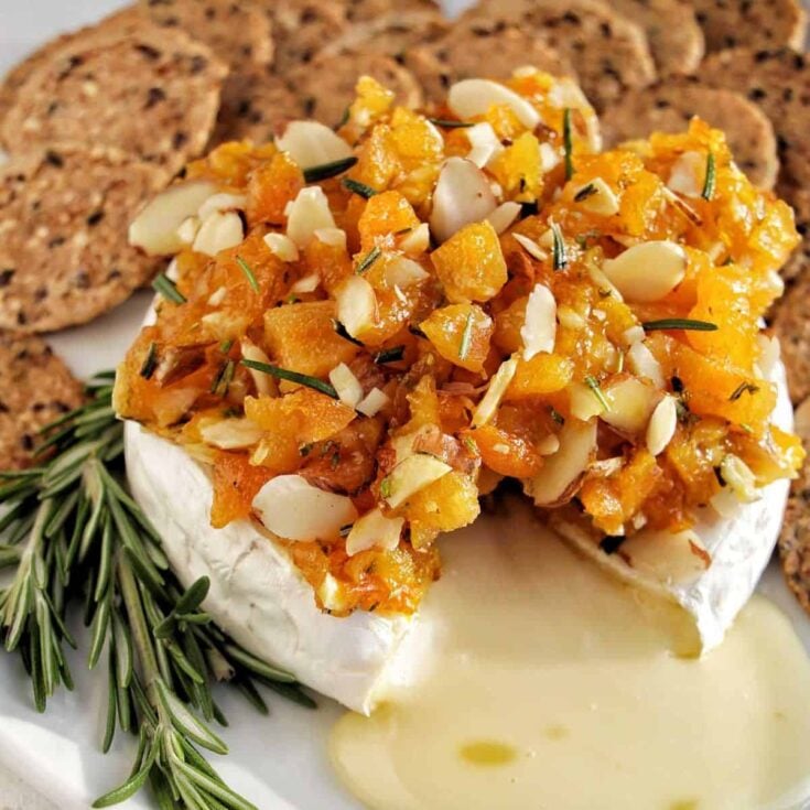 Baked brie with apricot jam made after reading these New Years Eve appetizers