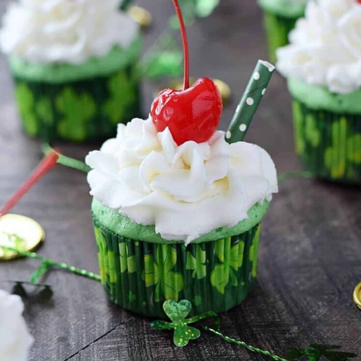 Boozy Shamrock shake cupcakes with a cherry on top, made after reading these St. Patricks Day treats