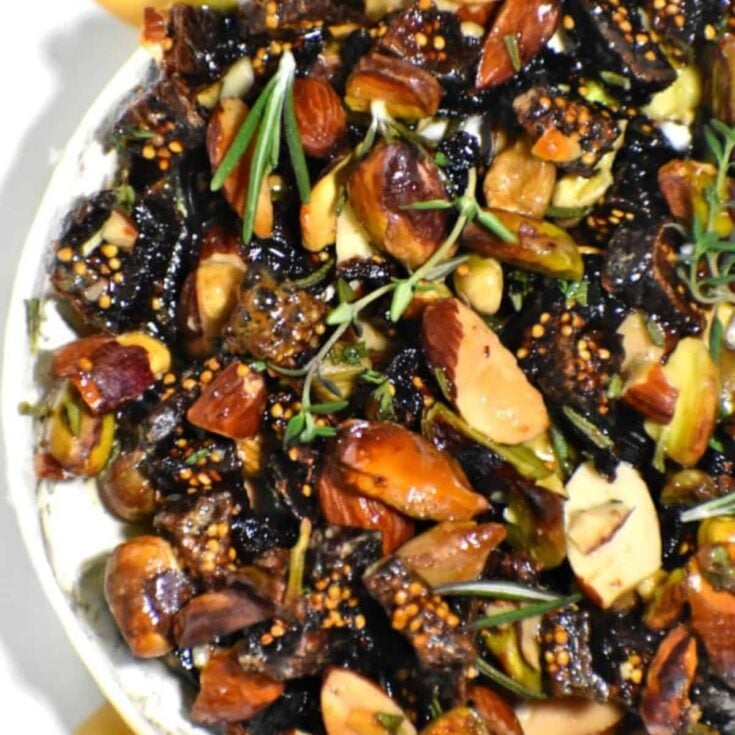 Easy baked brie with nuts and honey made after reading these New Years Eve appetizers
