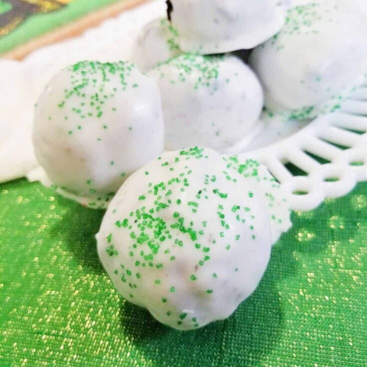 A set of Irish Cream Oreo truffles with green sprinkles made after reading these St. Patricks Day treats