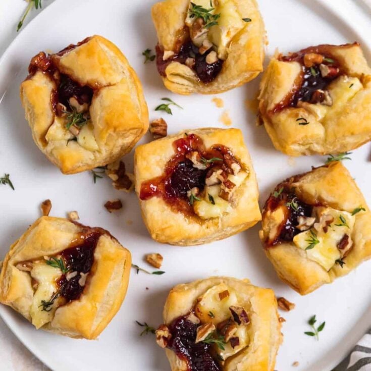 A plate of puff pastry brie bites made after reading these New Years Eve appetizers