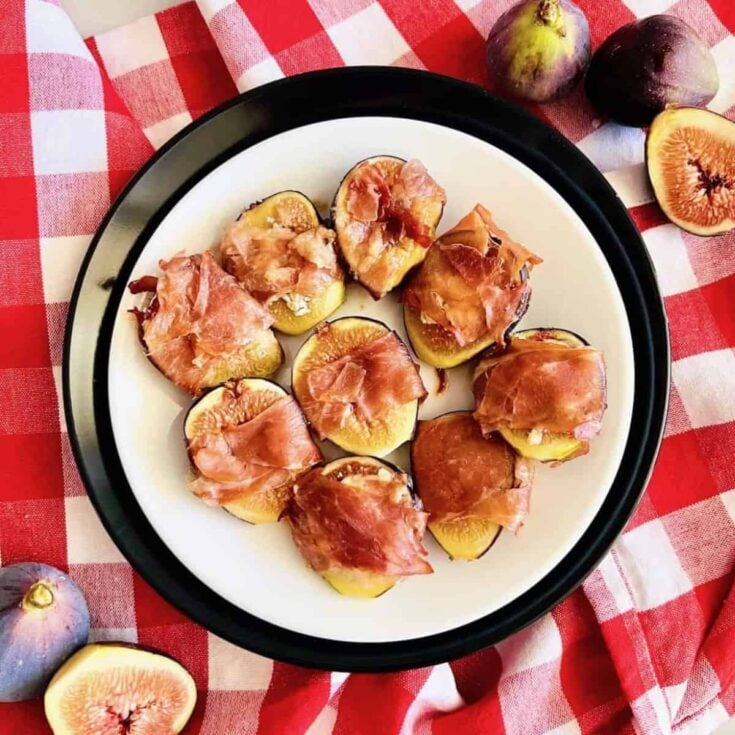 A plate of roasted prosciutto-wrapped figs made after reading these One bite appetizers