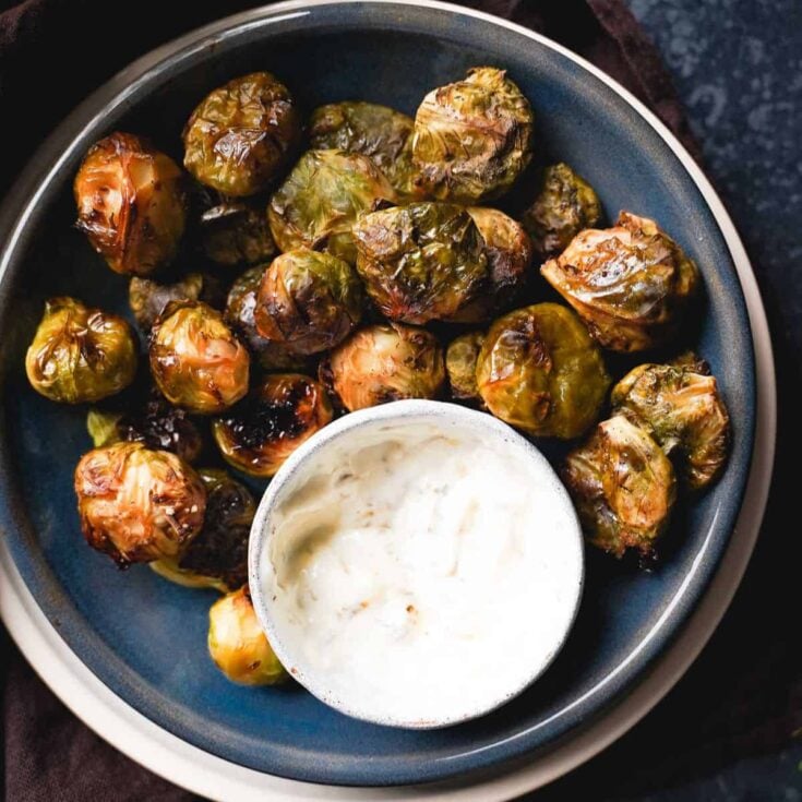 A plate of smashed Brussels sprouts made after reading these New Years Eve appetizers