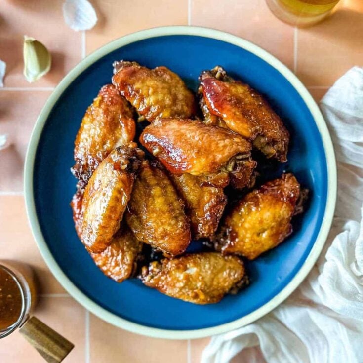 A plate of soy garlic chicken wings made after reading these New Years Eve appetizers