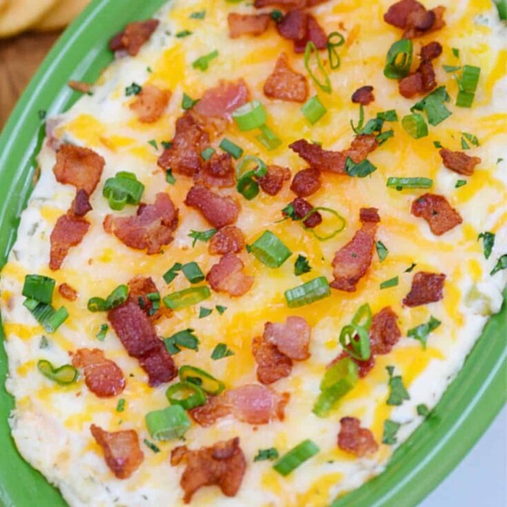 Baked feta and artichoke dip with olive gremolata