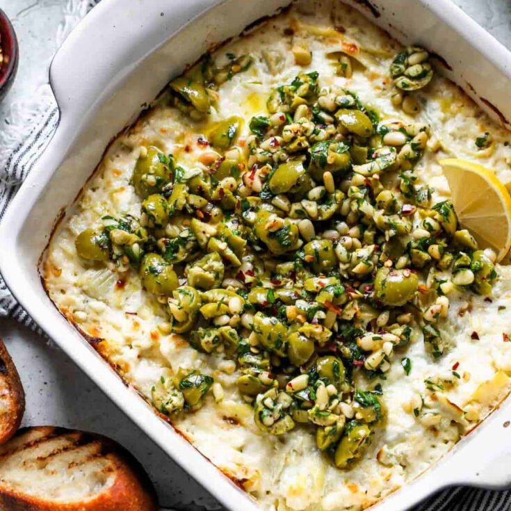 A bowl of baked feta dip