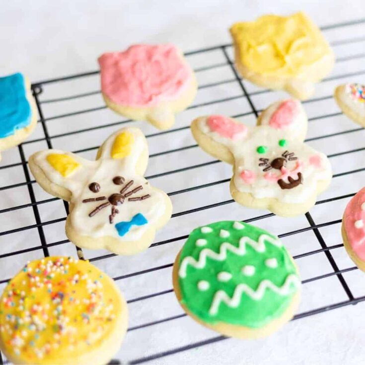 A tray of sour cream sugar cookies with cream cheese frosting