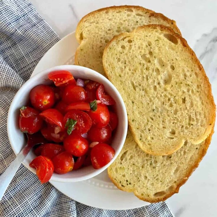 Bruschetta dip with garlic bread on the side