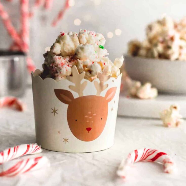 Candy cane popcorn in a paper cup