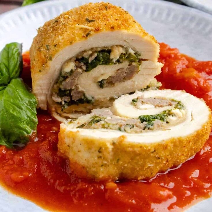 Chicken Rollatini with spinach and sausage filling on a plate