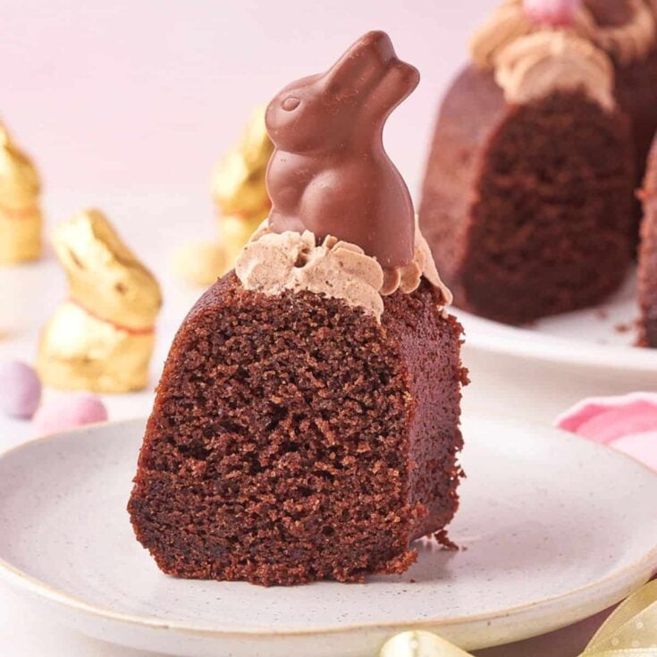 A slice of chocolate Easter Bundt cake with a chocolate bunny on top