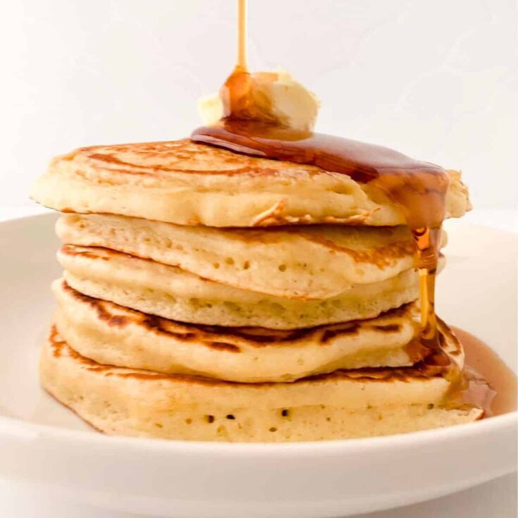 Copycat McDonalds pancakes topped with butter and maple syrup