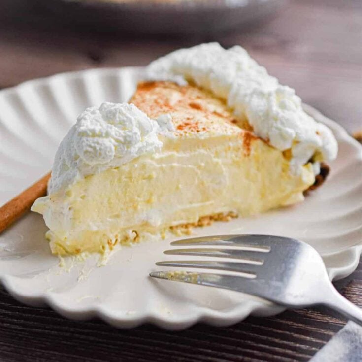 A slice of creamy no-bake eggnog pie made after reading these Christmas Desserts