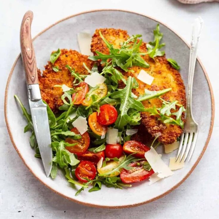 Crispy chicken Milanese with tomato arugula salad