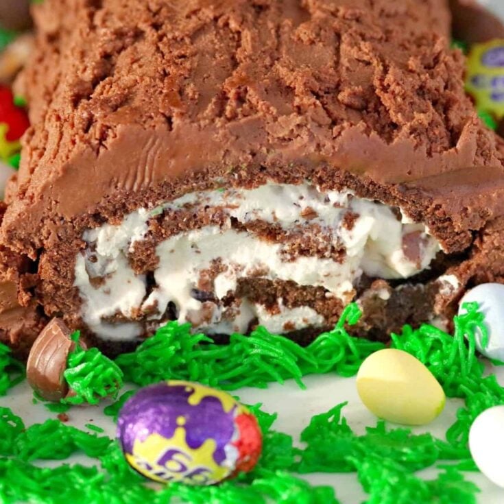 Easter creme egg Swiss roll cake surrounded with small eggs