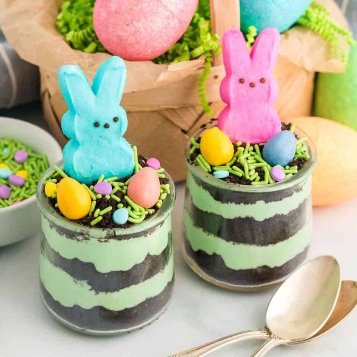 Easter dirt cake cups topped with colorful bunnies