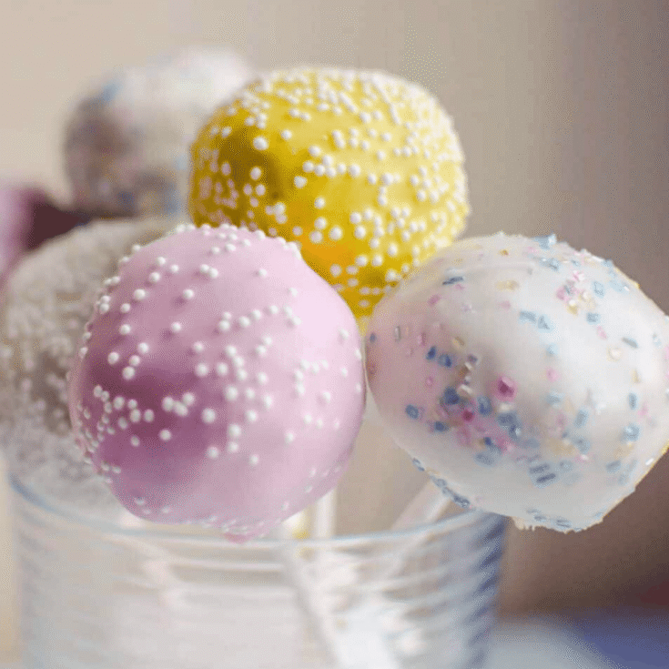 Colorful cake pops topped with sprinkles made after reading these Easter treat recipes