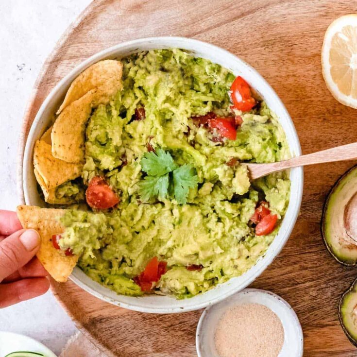 A bowl of guacamole without onion dip