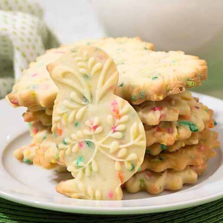 A plate filled with Funfetti embossed and plain shortbread cookies