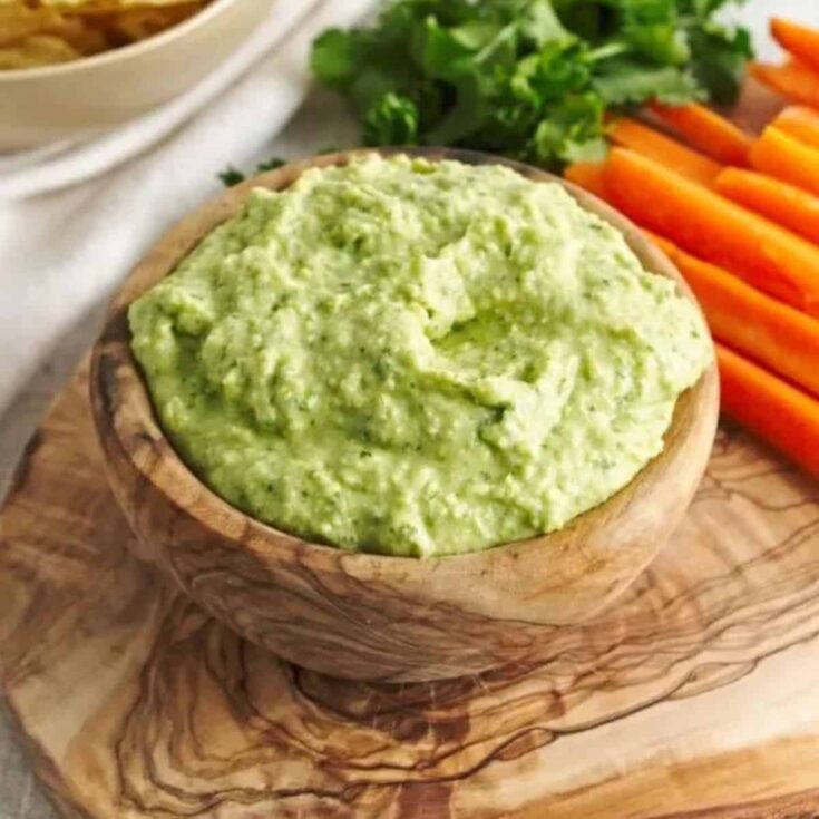 A bowl of green goddess hummus