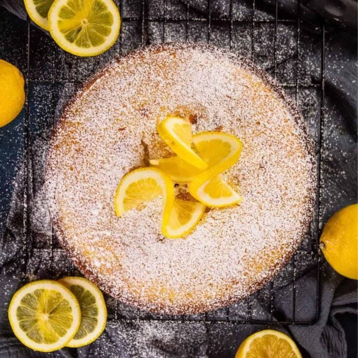 Lemon ricotta cake topped with slices of lemon