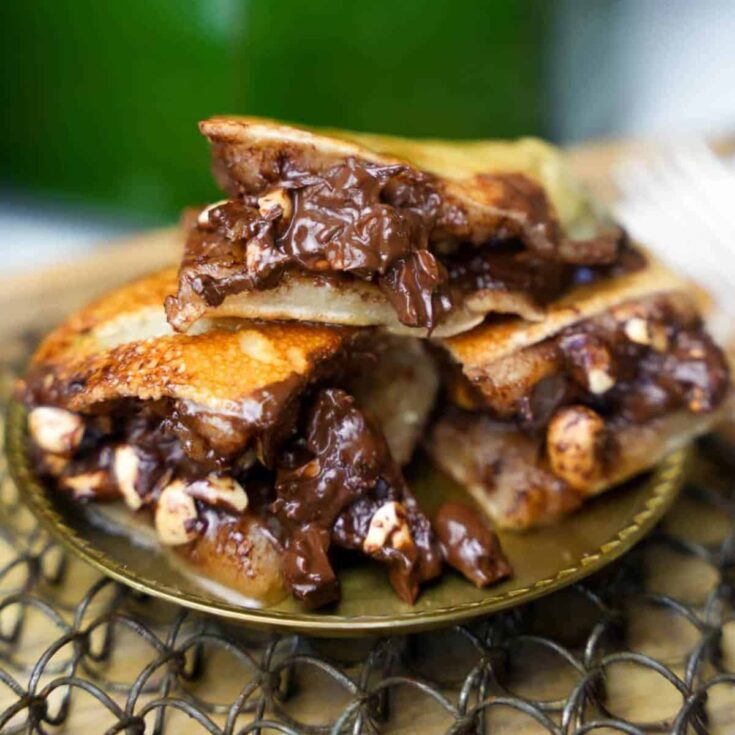 A plate of Martabak Manis Indonesian chocolate and peanut pancake
