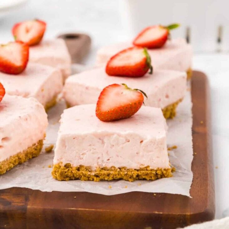 A tray filled with no bake strawberry cheesecake bars