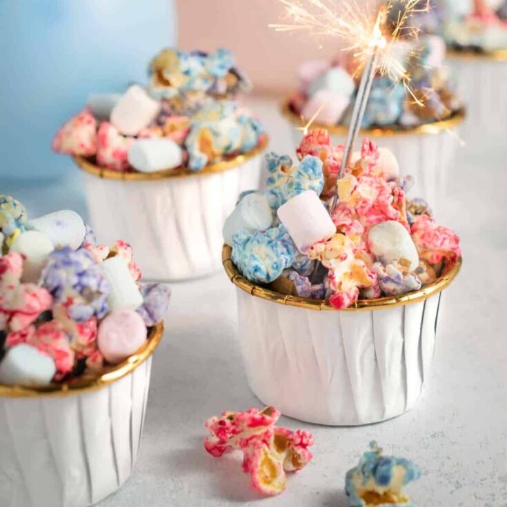 Rainbow popcorn topped with marshmallows