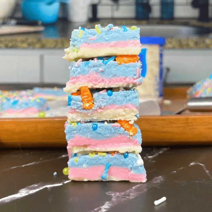 A stack of blue, white, and pink cheesecake Easter fudge