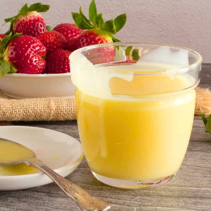 A glass of white chocolate sauce dip
