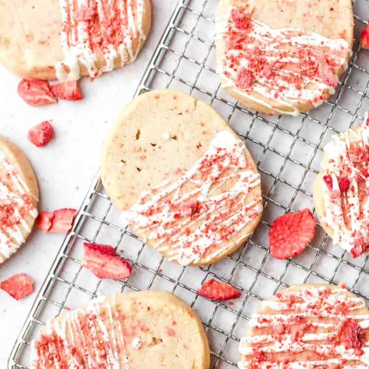 A tray filled with white chocolate strawberry shortbread cookies