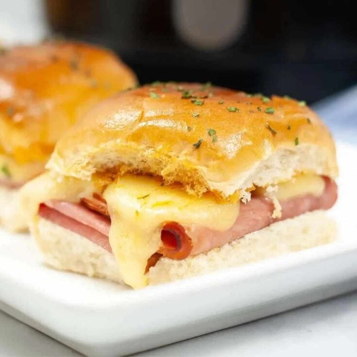 Air fryer ham and cheese sliders with aioli on a plate