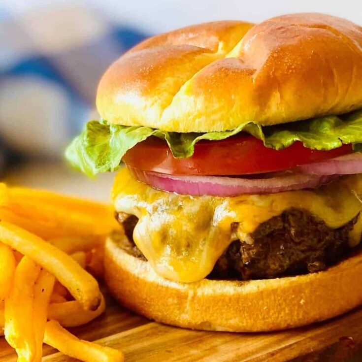 Blackstone smash burgers with fries on the side