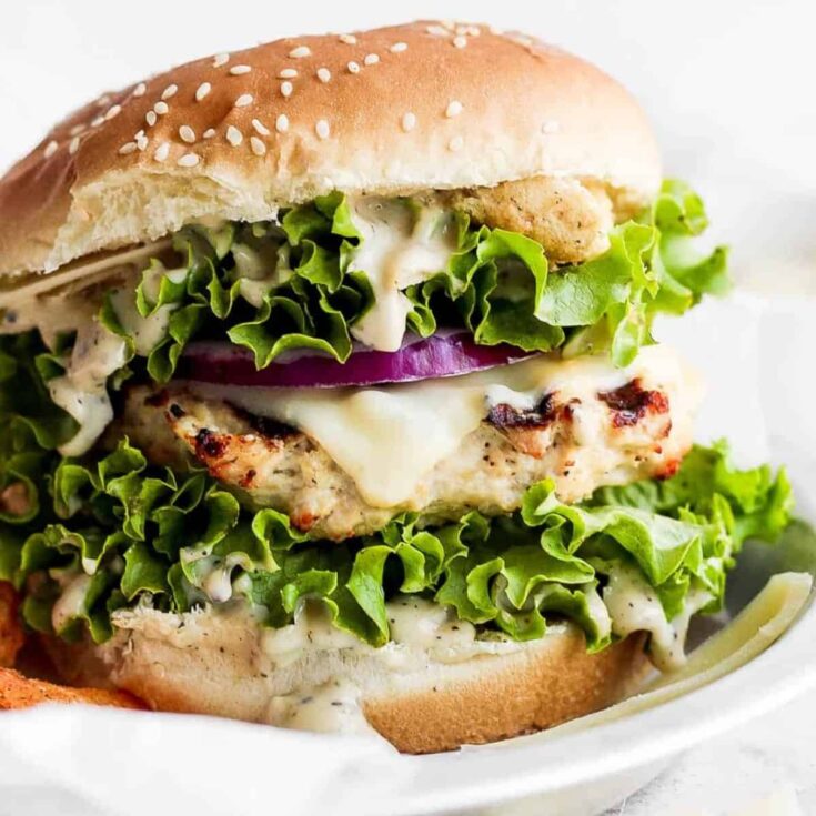 A plate of chicken caesar burger