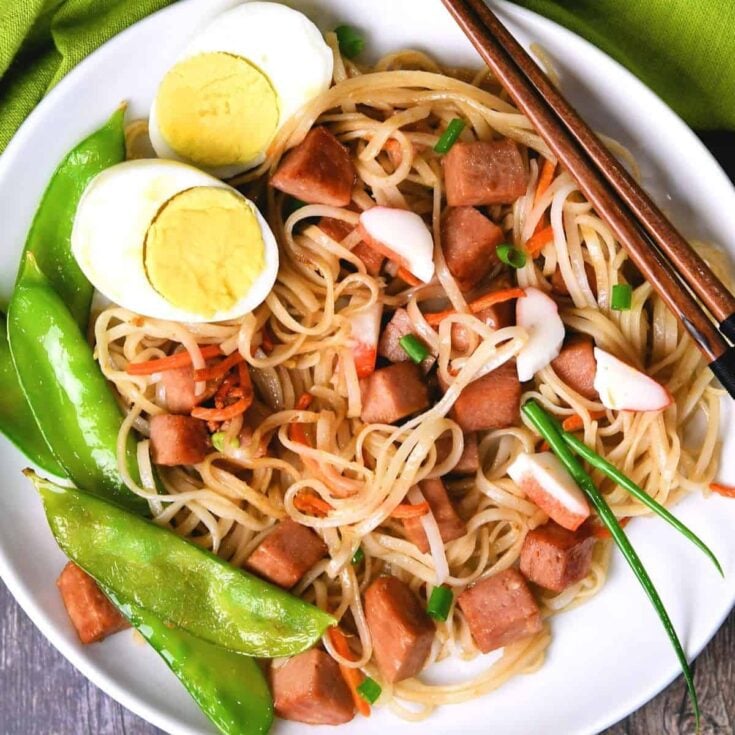 A plate of fried noodles with spam