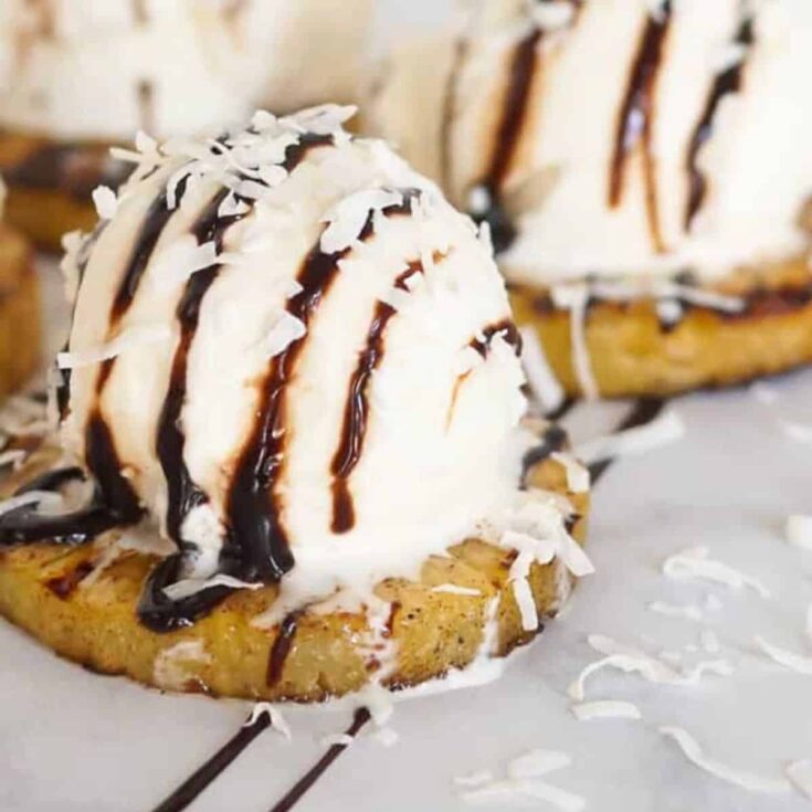 Grilled pineapple with ice cream on top