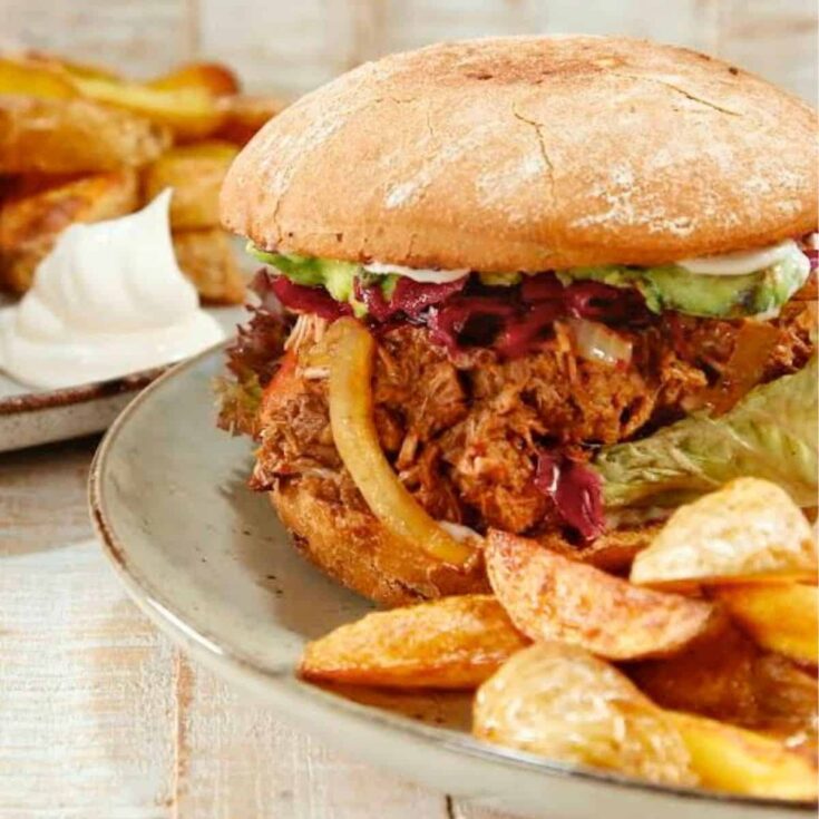 Juicy pulled jackfruit burger with potatoes on the side