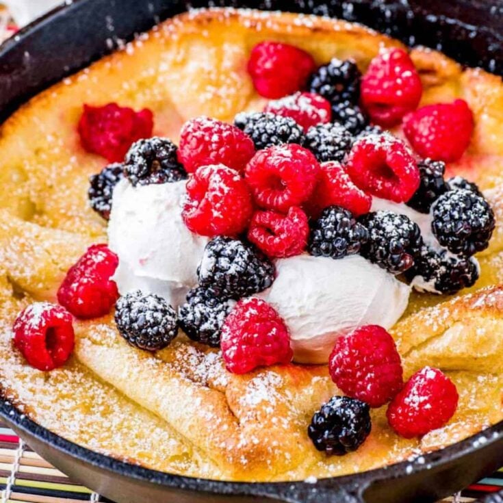 Mixed berry Dutch baby pancake in a pan