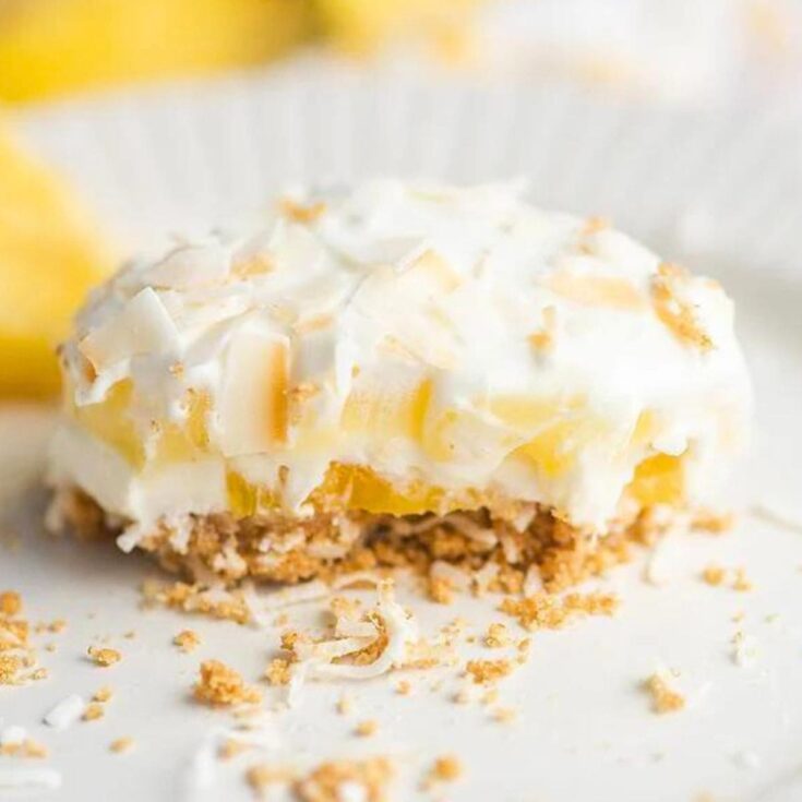 A plate of no bake coconut pineapple lush cake