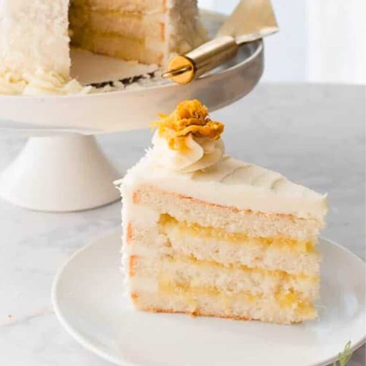A slice of Pina colada cake with vanilla buttercream